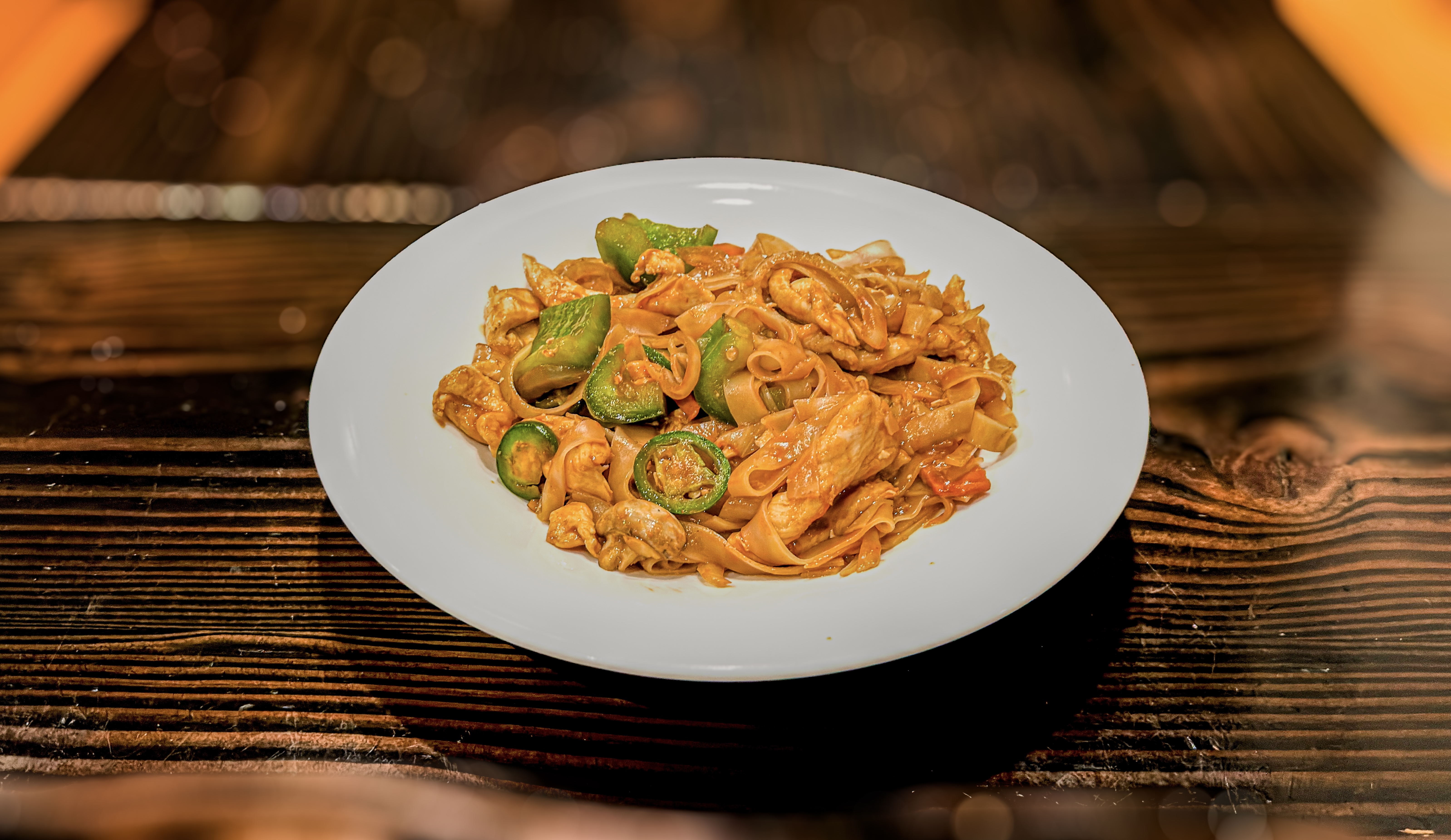 Drunken noodles with chicken and jalapeños