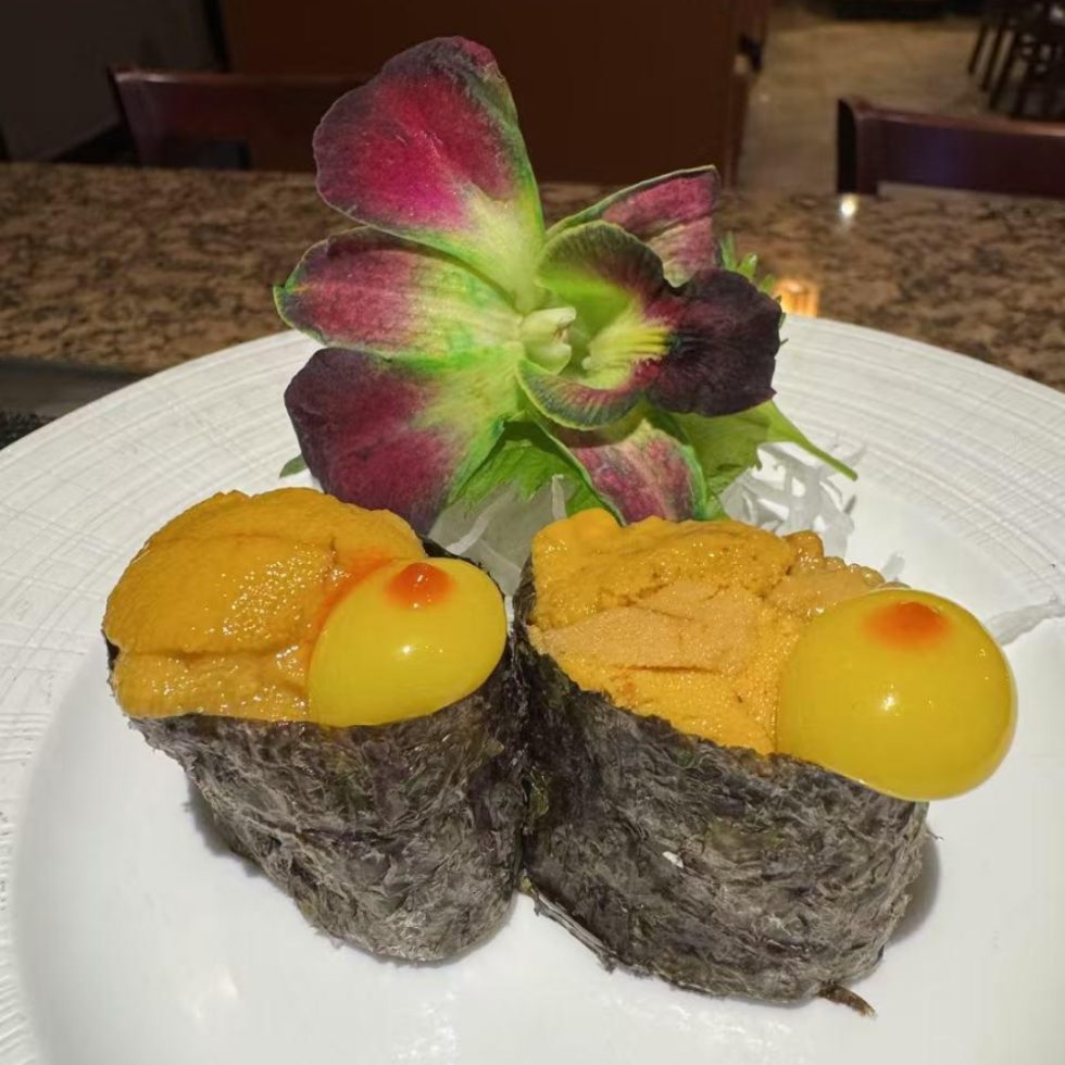 Uni gunkan topped with quail egg